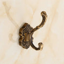 Antique bronze ornate wall hooks for bedroom metal scrollwork rack by Decorbites