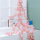 Pink artificial sakura flowers vine garden and wedding decor by Decorbites