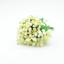 Vibrant assorted artificial stamen flowers for living room decor by Decorbites