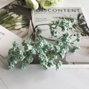 Pastel pink and lavender artificial succulent tree living room decor by Decorbites