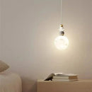 Modern white and gold astronaut lunar pendant light bedroom decor by Decorbites