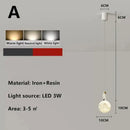 Modern white and gold astronaut lunar pendant light bedroom decor by Decorbites