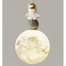 Modern white and gold astronaut lunar pendant light bedroom decor by Decorbites