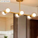 GobekUsa Brass Finish 6-Light Postmodern Linear Island Pendant with Glass Ball Shade