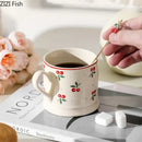 Cream cherry porcelain coffee mug with gold spoon – dining room tableware by Decorbites