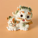 Yellow and turquoise ceramic mythology lion figurines living room decor by Decorbites