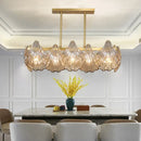 GobekUsa Contemporary Amber Crystal Pendant Light with Brass Island Lighting - 8 Lights, Linear Metal Arm