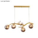 GobekUsa Contemporary Metal Branch Hanging Lamp Island Pendant - 4-Light Black/Gold with Bird Deco and Smoke Grey/Cognac Glass Shade