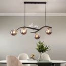 GobekUsa Contemporary Metal Branch Hanging Lamp Island Pendant - 4-Light Black/Gold with Bird Deco and Smoke Grey/Cognac Glass Shade