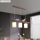 GobekUsa Contemporary Wood Island Pendant with Nutcracker Design and Cylindrical Glass Shades - Set of 3 Lights