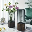 Creative retro glass vase with wood base for living room by Decorbites