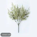 Mint green ceramic vase with yellow lemon grass branch living room by Decorbites