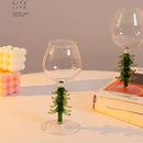 Festive green christmas wine glasses with tree stem dining room decor by Decorbites