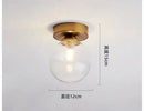 Modern brass & black glass ball ceiling light for living room by Decorbites