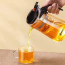 Modern glass tea brewing infuser kitchen teapot with black accents by Decorbites