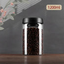 Clear glass vacuum sealed coffee beans jar kitchen storage with gold seal by Decorbites