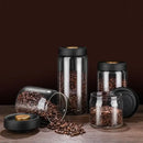 Clear glass vacuum sealed coffee beans jar kitchen storage with gold seal by Decorbites