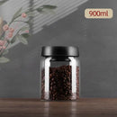 Clear glass vacuum sealed coffee beans jar kitchen storage with gold seal by Decorbites