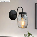 GobekUsa Industrial Clear Glass Wall Sconce with Black Jar Shade: Modern Bedroom Light Fixture with Floral Detail