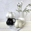 Playful white speckled butt shape ceramic coffee cup kitchen decor by Decorbites