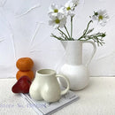 Playful white speckled butt shape ceramic coffee cup kitchen decor by Decorbites