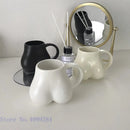 Playful white speckled butt shape ceramic coffee cup kitchen decor by Decorbites