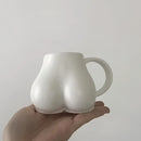 Playful white speckled butt shape ceramic coffee cup kitchen decor by Decorbites