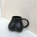 Playful white speckled butt shape ceramic coffee cup kitchen decor by Decorbites