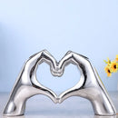 Glossy gold silver & black gesture heart sculpture living room decor by Decorbites