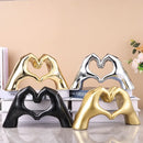 Glossy gold silver & black gesture heart sculpture living room decor by Decorbites