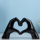 Glossy gold silver & black gesture heart sculpture living room decor by Decorbites