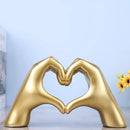 Glossy gold silver & black gesture heart sculpture living room decor by Decorbites
