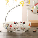 White lucky cat porcelain tea set kitchen ceramic teapot and cups by Decorbites