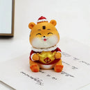 Lucky tiger figurine yellow living room new year decor holding gold bars by Decorbites
