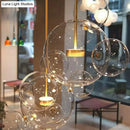 GobekUsa Minimal Brass Bubble Pendant Light with 5 Clear Glass Heads