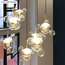 GobekUsa Minimal Brass Bubble Pendant Light with 5 Clear Glass Heads