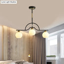 GobekUsa Modern Arched Island Pendant Light with Clear/White Glass and Black/Brass Finish - 3 Lights