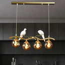 GobekUsa Modern Branch Island Pendant Light with Ball Glass Shade and Bird Deco - Metal 4-Light Fixture for Dining Room