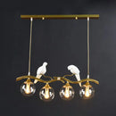 GobekUsa Modern Branch Island Pendant Light with Ball Glass Shade and Bird Deco - Metal 4-Light Fixture for Dining Room