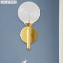 GobekUsa Modern Brass Wall Sconce Light - Clear Glass Sphere for Bedroom