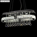 GobekUsa Modern LED Crystal Pendant Light with Stainless Steel Frame and Tassel Accents