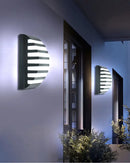 Modern black motion sensor outdoor wall light with frosted glass by Decorbites