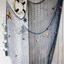 Nautical theme beige & navy blue fishing net wall decor living room by Decorbites