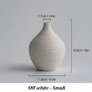 Nordic luxury textured white ceramic vase for living room decor by Decorbites