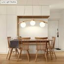 GobekUsa Nordic Wooden 3-Head Pendant Light with White Glass Shades - Arc Island Ceiling Lamp for Dining Room