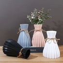 Origami style pink blue and white plastic flower vase living room by Decorbites