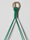 Boho pink green wooden macrame hanging shelf for kids room by Decorbites