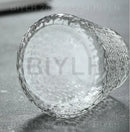 Small transparent glass vase with bamboo base for living room decor