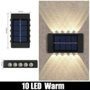 Modern black solar outdoor wall lights garden warm led beam by Decorbites