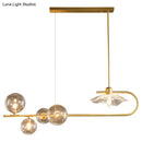 GobekUsa Stylish Brass Finish Postmodern Suspension Lamp with Glass Shade - Creative Island Light featuring Ball and Lotus Leaf Design